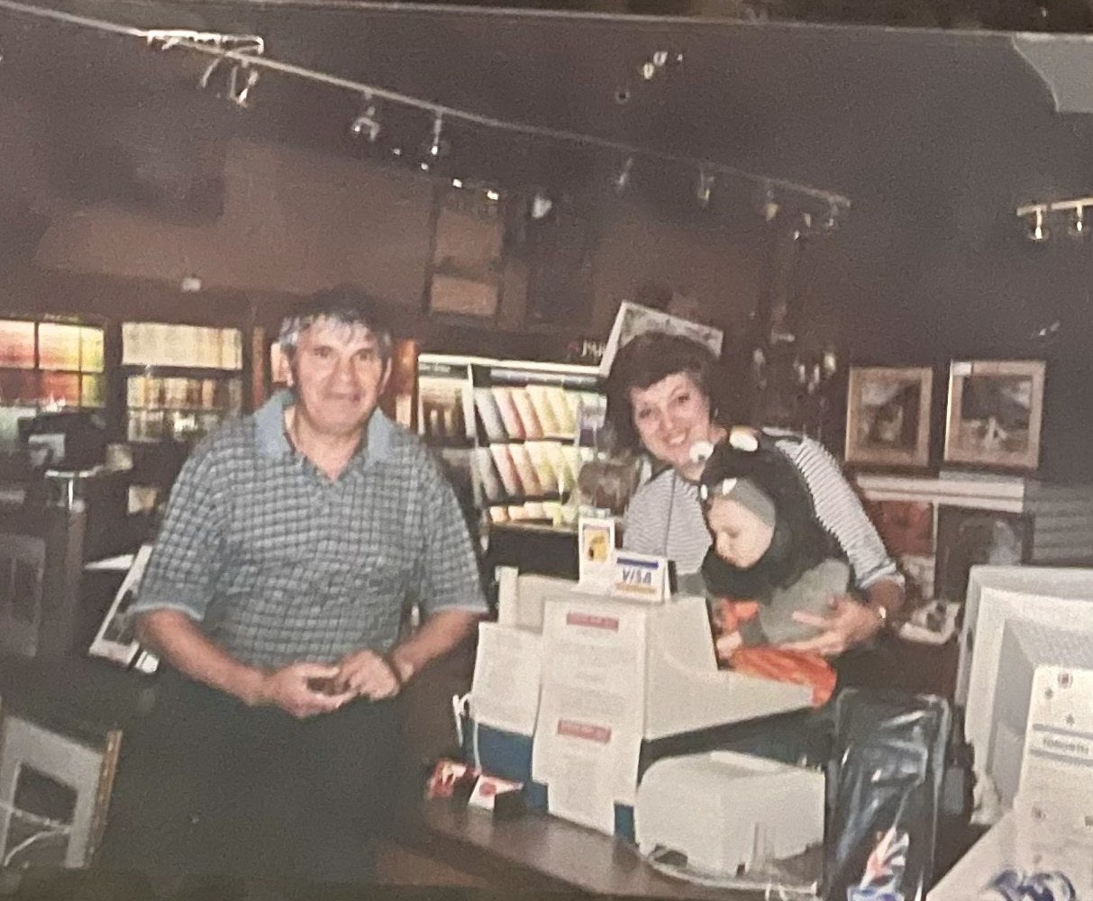 Rosa Raimondi with family behind the Colour Land counter