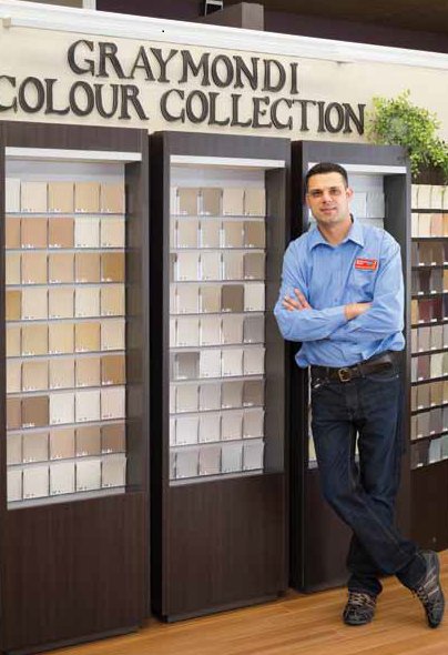 Peter Raimondi beside the original Graimondi Colour Collection display